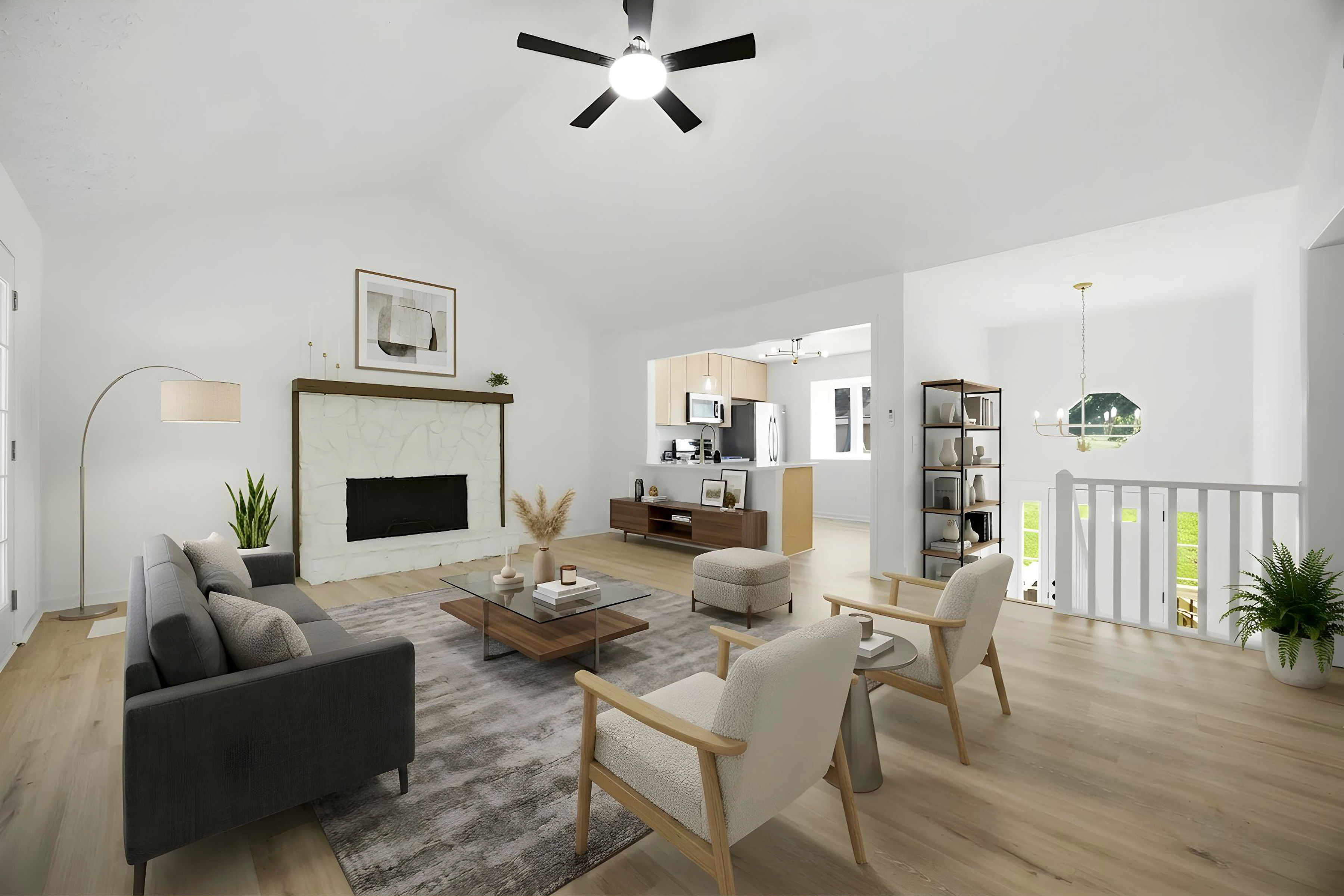 Living room with white fireplace, seating, and loft rail